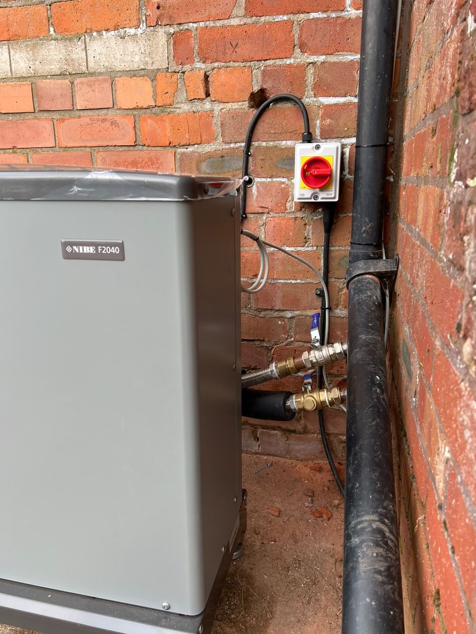 NIBE air source heat pump outdoor unit with dedicated isolator switch
