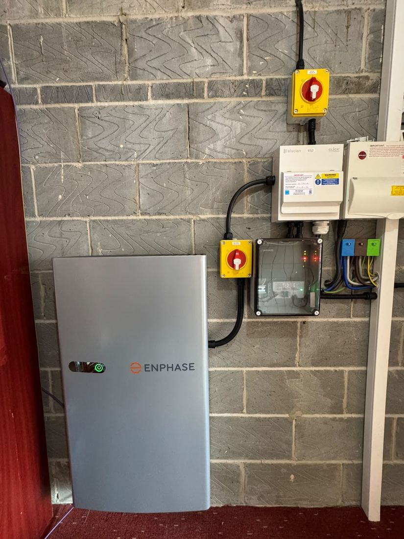 Enphase battery storage installed next to a consumer unit